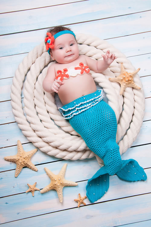 A Baby Girl in a Mermaid Costume