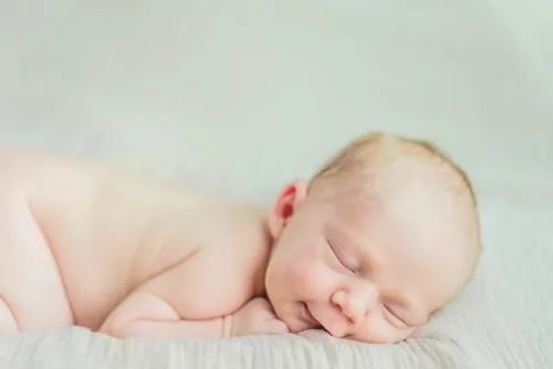 Young Baby Sleeping Happily During Photoshoot
